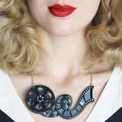 Erstwilder -Erstwilder erstwilder hollywood film reel necklace model